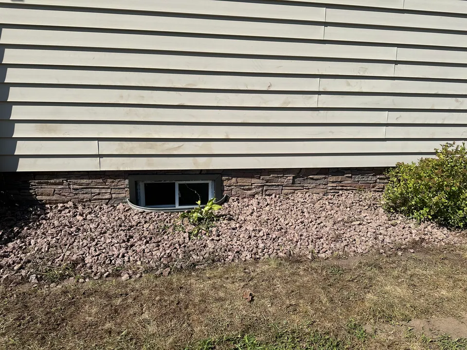 New vinyl siding with stone-look foundation skirting