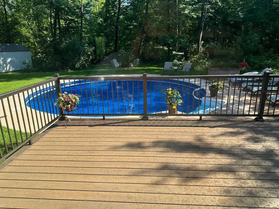 Pool deck with black aluminum railing